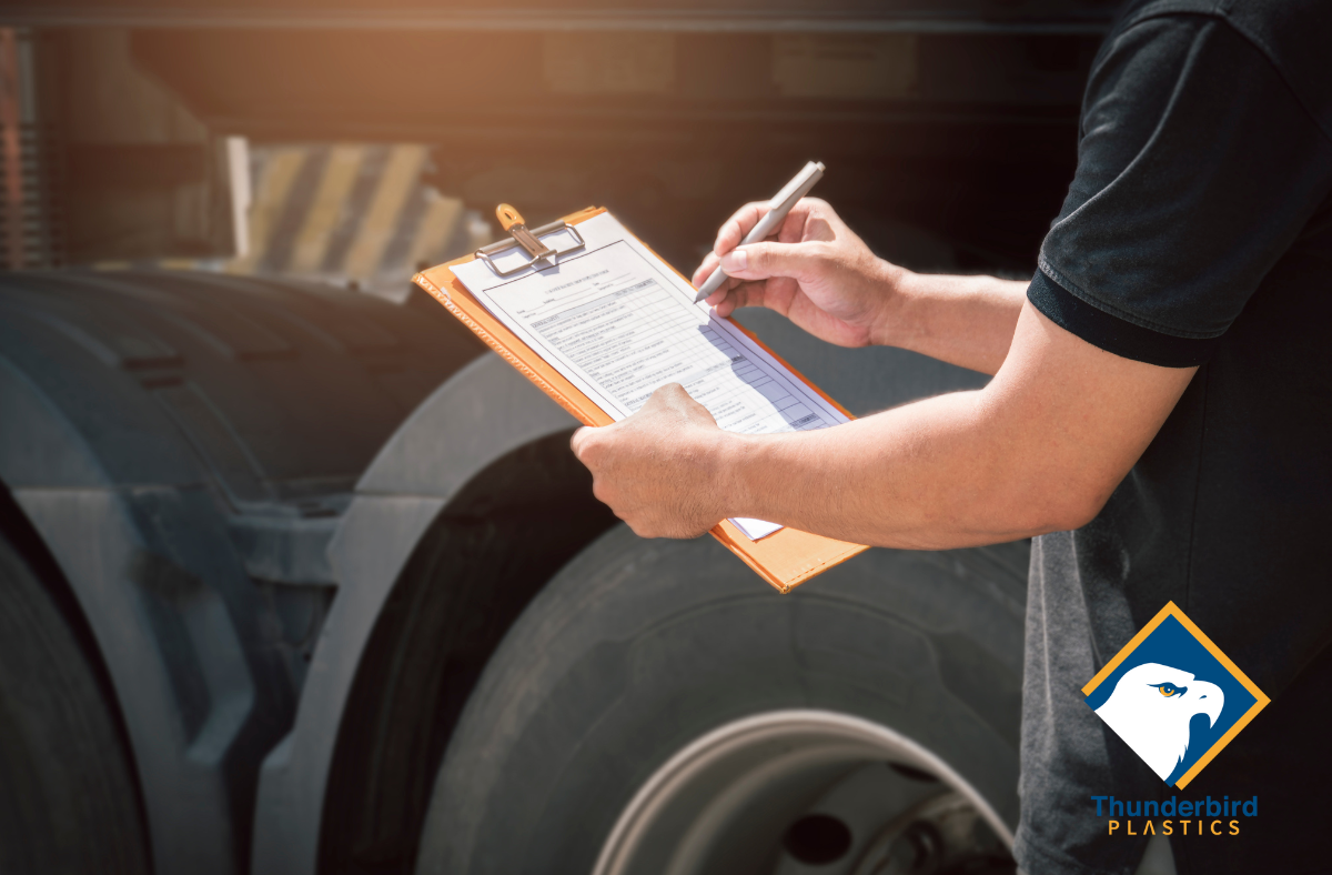 Someone holding a clipboard with a truck tire in the background. Tags: agricultural harvesting containers, greenhouse automation, greenhouse harvesting bins, produce lugs, harvest totes, plastic farm bins, automated farming equipment, injection moulded containers, stackable harvest crates, greenhouse farming Canada, cucumber totes, bulk harvesting bins, sustainable agriculture containers, plastic totes for farming, farming automation tools, greenhouse produce handling, Canadian agriculture supplies, automated greenhouse systems, custom farm containers